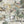 Animal Islands wallpaper by Brand McKenzie in cream and green, close-up of palm-filled islands and wildlife