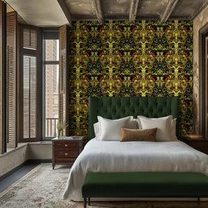 Gilded Wine wallpaper by Liberty James Studio in gold, green and red, an ornate mirrored design in a bedroom