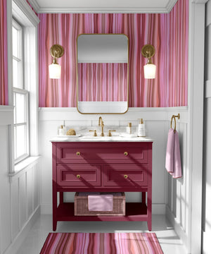 Bel Harbour wallpaper by Liberty James Studio in coral, varied stripes on a bathroom wall