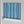 Bel Harbour wallpaper by Liberty James Studio in blue, sample roll showing varied stripes
