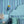 Bel Harbour wallpaper by Liberty James Studio in blue, varied stripes behind a bed