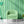 Bel Harbour wallpaper by Liberty James Studio in green, varied stripes in a living room