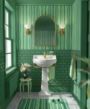 Bel Harbour wallpaper by Liberty James Studio in green, varied stripes in a bathroom