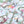Balancing Act wallpaper by Brand McKenzie in blue, close-up of monkeys, toucans and flamingos in vines