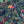 Balancing Act wallpaper by Brand McKenzie in navy, close-up of monkeys, toucans and flamingos in vines