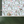 Balancing Act wallpaper by Brand McKenzie in mint green and pink, monkeys, toucans and flamingos in vines above a cabinet