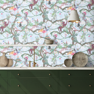 Balancing Act wallpaper by Brand McKenzie in blue, monkeys, toucans and flamingos in vines above a sideboard