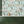 Balancing Act wallpaper by Brand McKenzie in mint green and pink above a sideboard (alternate view)