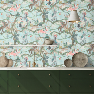 Balancing Act wallpaper by Brand McKenzie in mint green and pink, monkeys, toucans and flamingos in vines above a sideboard