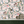 Balancing Act wallpaper by Brand McKenzie in orange, monkeys, toucans and flamingos in vines above a sideboard