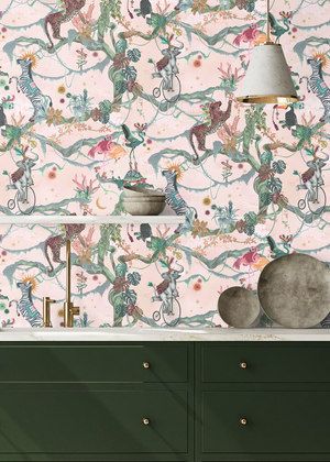 Balancing Act wallpaper by Brand McKenzie in orange, monkeys, toucans and flamingos in vines above a sideboard