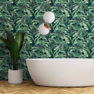 Banana Leaves Standard wallpaper by Brand McKenzie in green, banana leaves on a bathroom wall