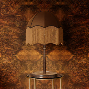 Beau Burr wallpaper by Liberty James Studio in brown and orange, a burr wood grain design in a styled room setting