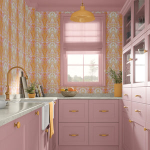 Bel Air Blossom wallpaper by Liberty James Studio in apricot, a mirrored blossom design in a kitchen