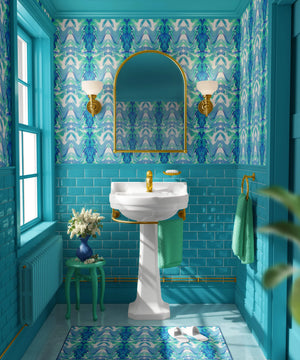 Bel Air Blossom wallpaper by Liberty James Studio in blue, a mirrored blossom design on a bathroom wall