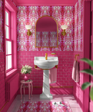 Bel Air Blossom wallpaper by Liberty James Studio in pink, a mirrored blossom design in a bathroom setting