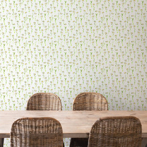 Betsy wallpaper by Seed Home Designs in yellow and green, delicate ditsy flowers in a dining area