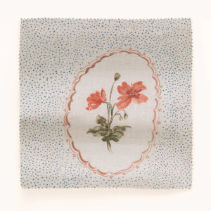 Bibury Sprig linen by Parker and Jules in pale blue, draped, showing embroidered flowers in ovals