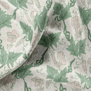 Bindweed Pink Trumpet velvet by Annika Reed in green and pink, draped, showing trailing bindweed flowers