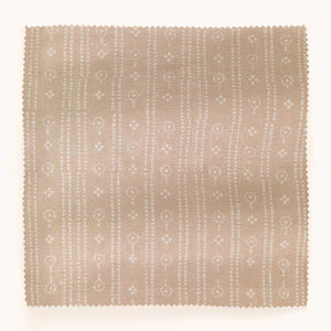 Birdlip linen by Parker and Jules in beige, draped close-up of a small block-print stripe