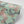 Blossom Mint wallpaper by Tatie Lou in mint green, roll showing blossoms and birds