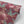 Blossom Rouge wallpaper by Tatie Lou in red, roll showing blossoms and birds