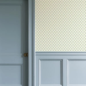 Bluebell wallpaper by Annika Reed in cream and green, tiny bluebell sprigs in a hallway