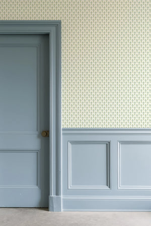 Bluebell wallpaper by Annika Reed in cream and green, tiny bluebell sprigs in a hallway