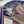 Blues Fantasia wallpaper by The Monkey Puzzle Tree in blue and red, detail of an art deco musician motif
