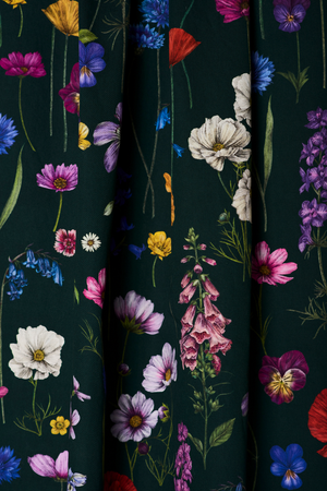 Botanica fabric by Victoria Sanders in green, wildflowers and poppies hung as curtains