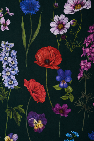 Botanica fabric by Victoria Sanders in green, pattern sample of wildflowers and poppies