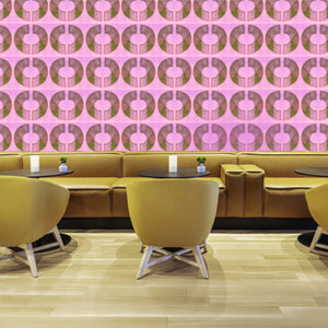 Boucle wallpaper by Tatie Lou in pink, bold retro rings in a dining area