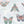 Butterfly Effect wallpaper by Brand McKenzie in white and pink, close view of butterflies and moths