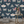 Butterfly Effect wallpaper by Brand McKenzie in navy, butterflies and moths on a bedroom wall