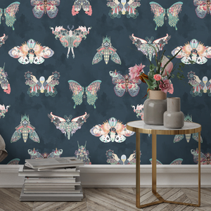 Butterfly Effect wallpaper by Brand McKenzie in navy, butterflies and moths on a bedroom wall