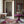Chateau Stripe wallpaper by Tatie Lou in red and blue, floral stripes in a bathroom