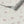 Caja Floral wallpaper by Seed Home Designs in grey, flat sample of line-drawn daisies