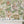 Carnival Map wallpaper by Brand McKenzie in green, pattern detail of an illustrated carnival map