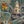 Carnival Map wallpaper by Brand McKenzie in teal, close view of an illustrated carnival map