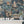 Carnival Map wallpaper by Brand McKenzie in blue, pattern detail of an illustrated carnival map