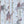 Carousel wallpaper by Brand McKenzie in blue, close view of carousel animals on poles