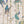 Carousel wallpaper by Brand McKenzie in cream, detail of carousel animals on poles
