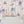 Carousel wallpaper by Brand McKenzie in pink, close-up of carousel animals on poles