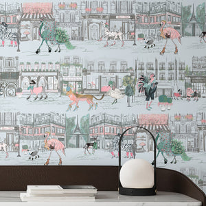 Catwalk wallpaper by Brand McKenzie in pink and blue, pattern detail of animals parading down a city street