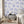 Charming Lanes wallpaper by Brand McKenzie in blue, toile-style townhouses in a bedroom