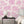 Charming Lanes wallpaper by Brand McKenzie in fuchsia, detail of toile-style townhouses