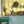 Citrus wallpaper by Liberty James Studio in yellow, wide stripes in a kitchen