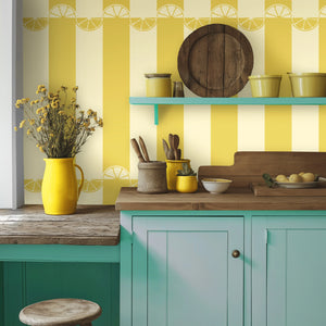 Citrus wallpaper by Liberty James Studio in yellow, wide stripes in a kitchen