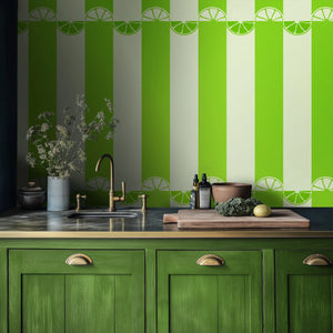 Citrus wallpaper by Liberty James Studio in lime green, wide stripes above kitchen cabinets
