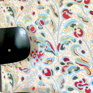 Carmen wallpaper by Claire de Quénetain in yellow and blue, a hand-painted floral design in a styled room setting